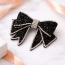 Black crystal bow hair clip with silver detailing for party and festive wear